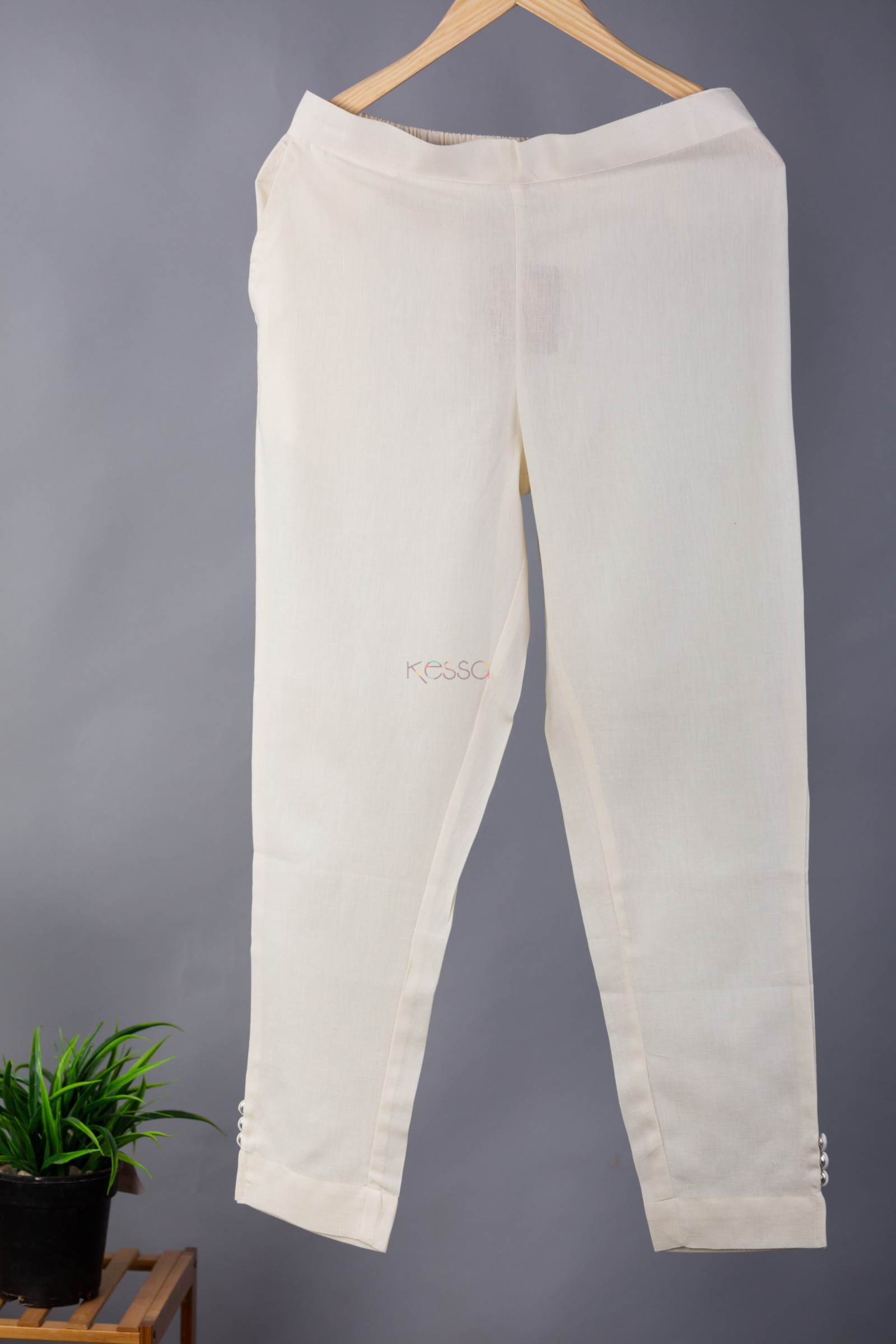 Summers tend to become breezy and beautiful when spent wearing this beige cotton  flex pants. Wear along with a bright coloured short kurti for a cheerful  and girl-next-door look.